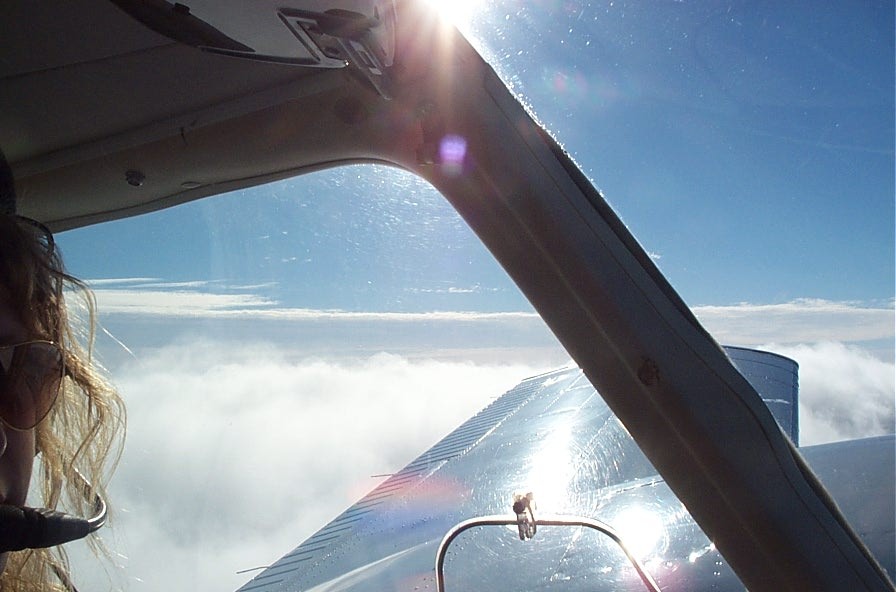 Langley Flying School's Piper Seneca over the top above Oregon. Pilot: Caroline Kristensen.
